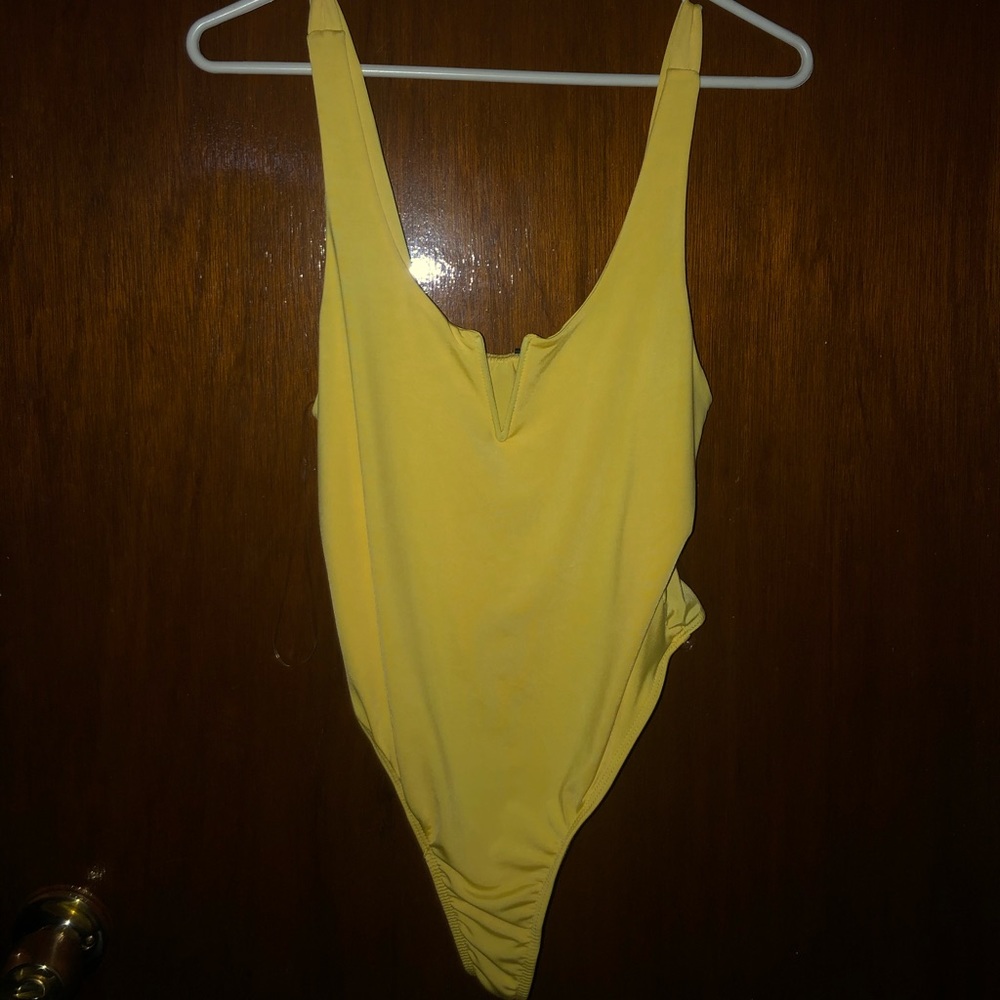 yellow bodysuit